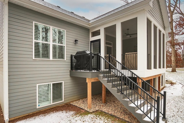 exterior space featuring a ceiling fan