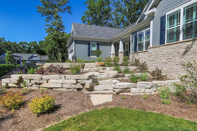 view of exterior entry with stone siding