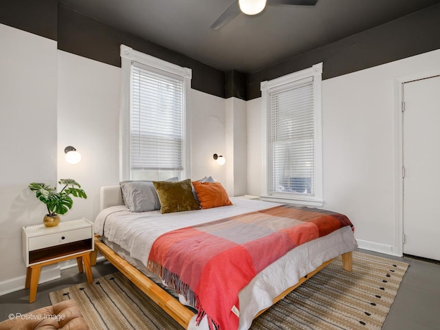 bedroom featuring a ceiling fan and baseboards