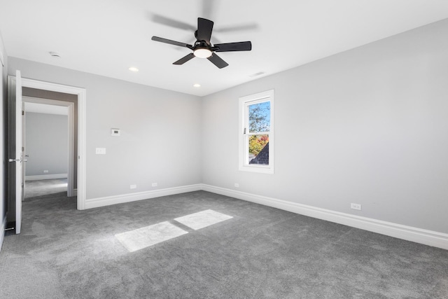 unfurnished bedroom featuring baseboards, carpet floors, and visible vents