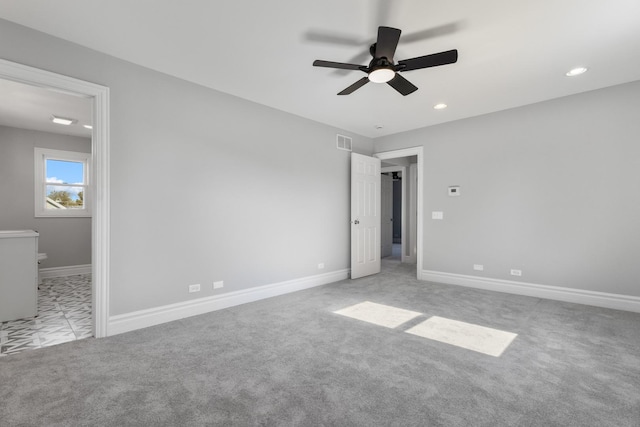 unfurnished bedroom featuring recessed lighting, visible vents, carpet floors, and baseboards