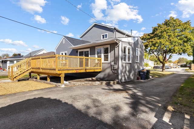 exterior space featuring a wooden deck