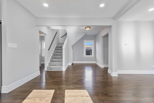 interior space featuring recessed lighting, stairway, baseboards, and wood finished floors