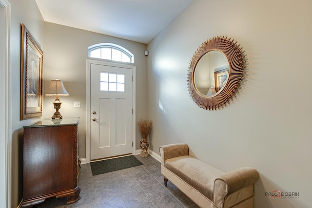 foyer featuring baseboards