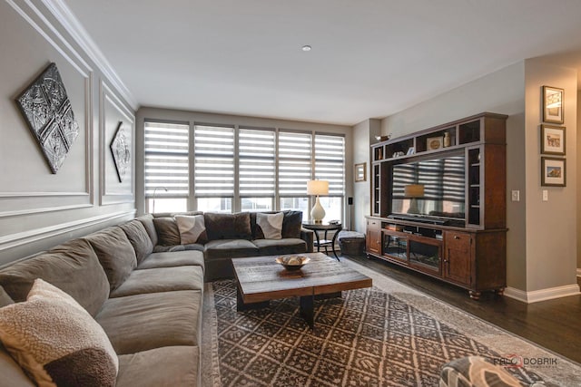 living area with dark wood finished floors and baseboards