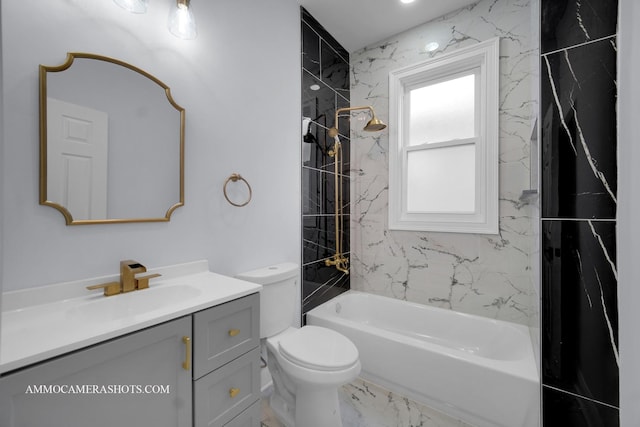 bathroom featuring marble finish floor, vanity, toilet, and shower / bathtub combination