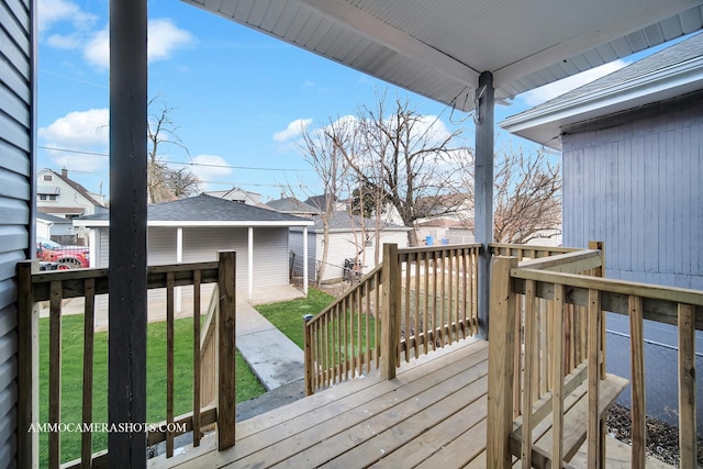 wooden terrace featuring a yard