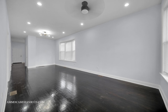 empty room with dark wood-style floors, ceiling fan, baseboards, and recessed lighting