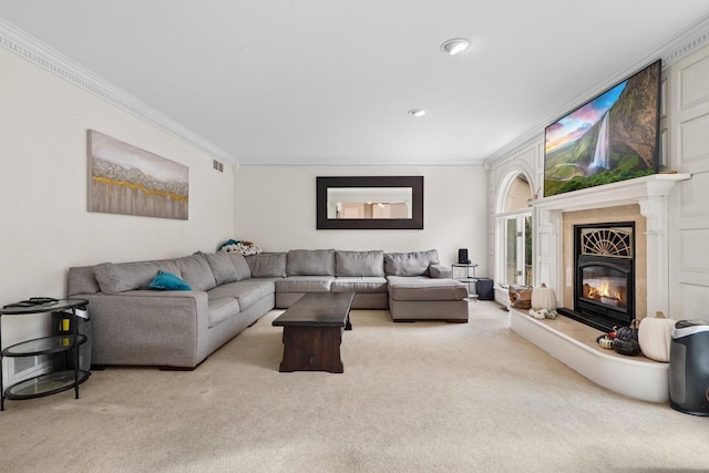 living area with recessed lighting, light carpet, visible vents, ornamental molding, and a tiled fireplace