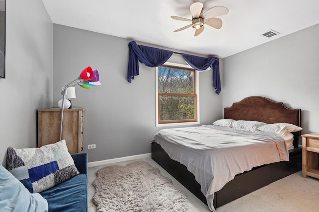 bedroom with carpet floors, baseboards, and visible vents