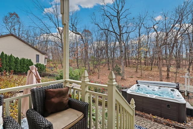 wooden terrace featuring a hot tub