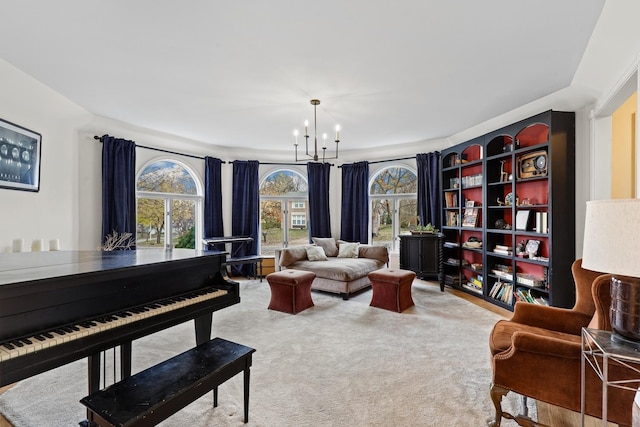 living area with carpet floors and a notable chandelier