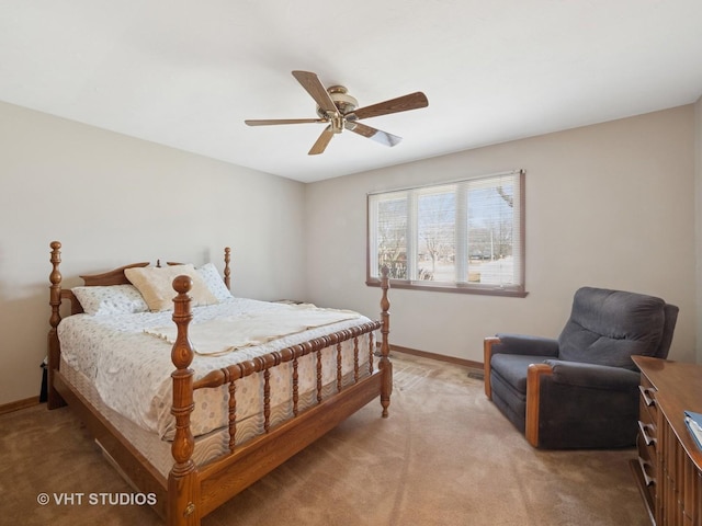 bedroom with a ceiling fan, light colored carpet, and baseboards