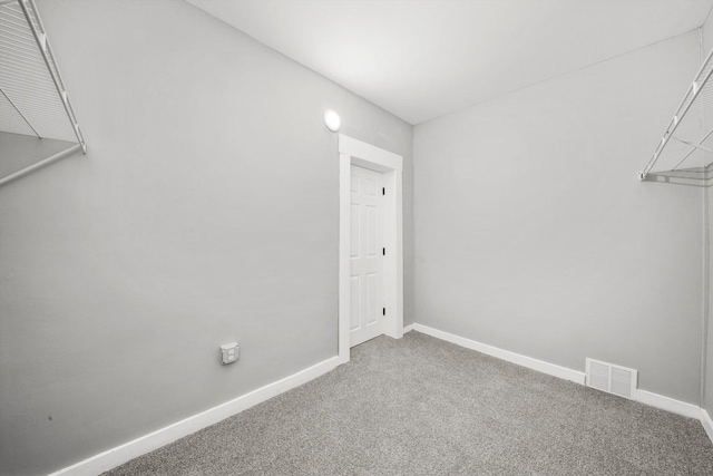 spacious closet with carpet and visible vents