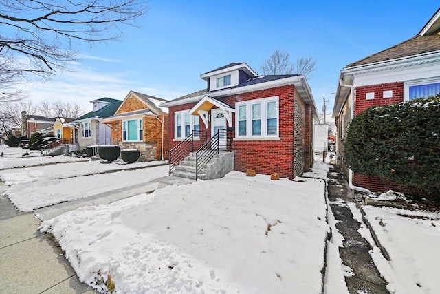 bungalow-style home with a residential view and brick siding