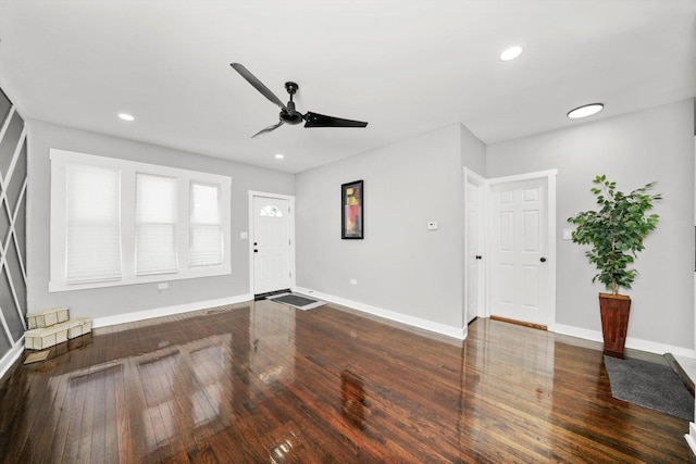 unfurnished living room with dark wood-style floors, recessed lighting, baseboards, and a ceiling fan