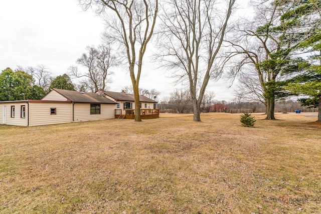 view of yard featuring a wooden deck