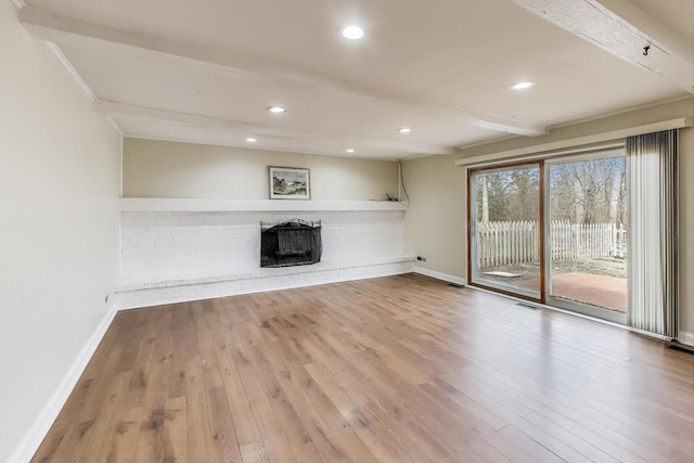 6 Robin Hood Ct, Lincolnshire, IL 60069 - unfurnished living room with baseboards, beamed ceiling, a fireplace, and wood finished floors