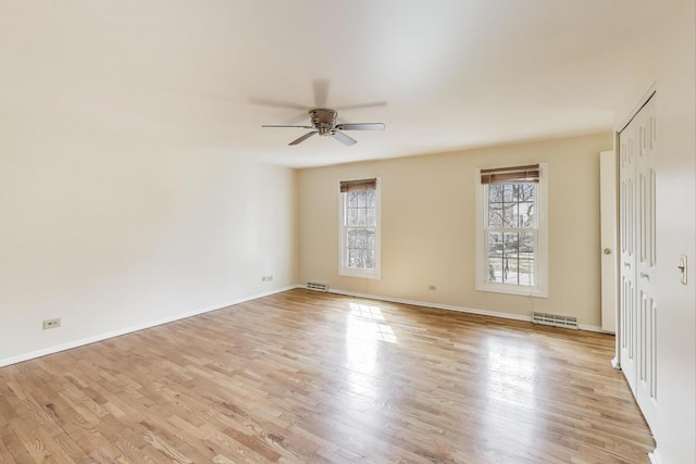 6 Robin Hood Ct, Lincolnshire, IL 60069 - empty room featuring a ceiling fan, baseboards, light wood finished floors, and visible vents