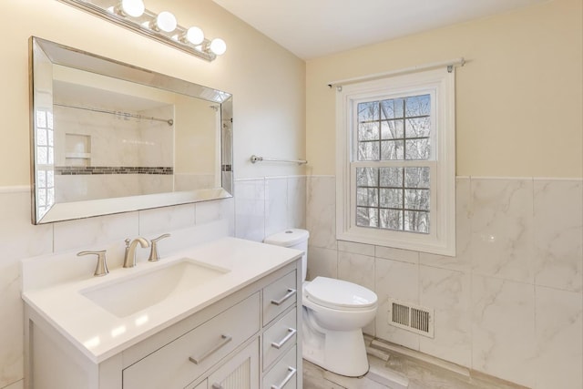6 Robin Hood Ct, Lincolnshire, IL 60069 - full bath featuring toilet, tile walls, visible vents, wainscoting, and vanity