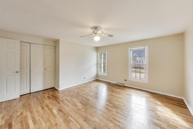 6 Robin Hood Ct, Lincolnshire, IL 60069 - unfurnished bedroom featuring baseboards, a closet, visible vents, and light wood-style floors