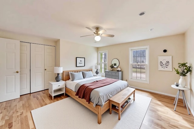 6 Robin Hood Ct, Lincolnshire, IL 60069 - bedroom with light wood finished floors, a closet, a ceiling fan, and baseboards