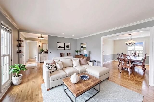 6 Robin Hood Ct, Lincolnshire, IL 60069 - living area featuring an inviting chandelier, plenty of natural light, light wood-style flooring, and crown molding