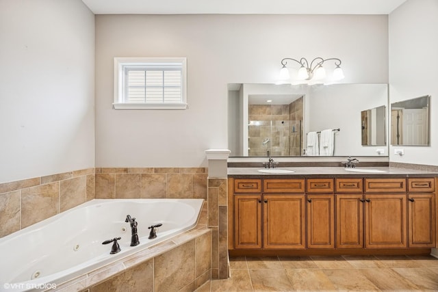 full bath featuring a stall shower, a sink, a whirlpool tub, and double vanity