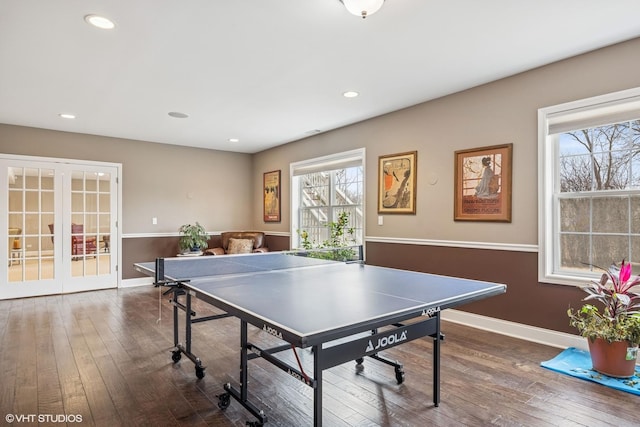 game room with dark wood-type flooring, recessed lighting, and baseboards