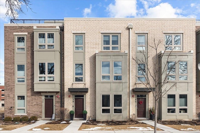 view of front facade featuring brick siding