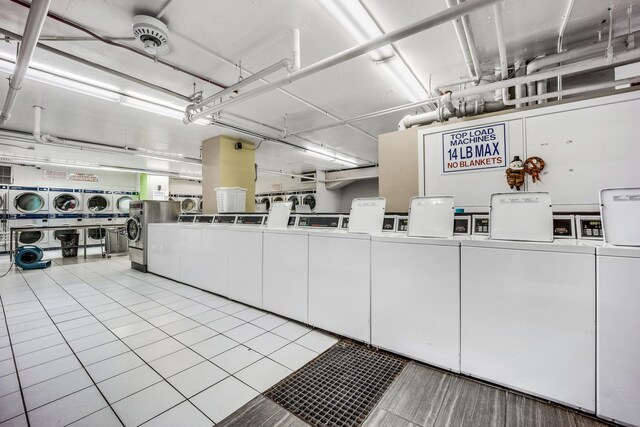 reception area featuring stacked washer / drying machine and washer and clothes dryer