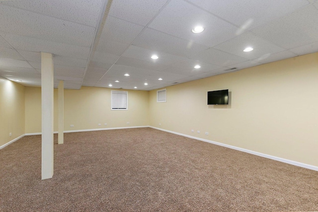 finished basement featuring carpet flooring and baseboards