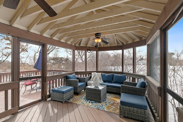 sunroom / solarium featuring a ceiling fan and lofted ceiling