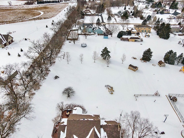 snowy aerial view featuring a residential view