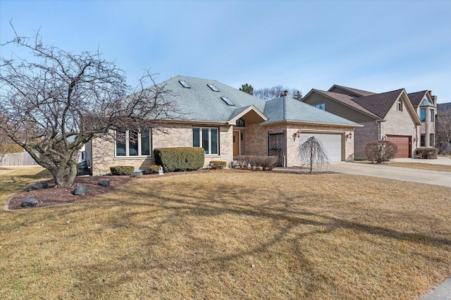 view of front of property with concrete driveway, roof with shingles, an attached garage, a front yard, and brick siding