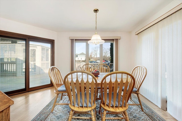 dining area with light wood-type flooring