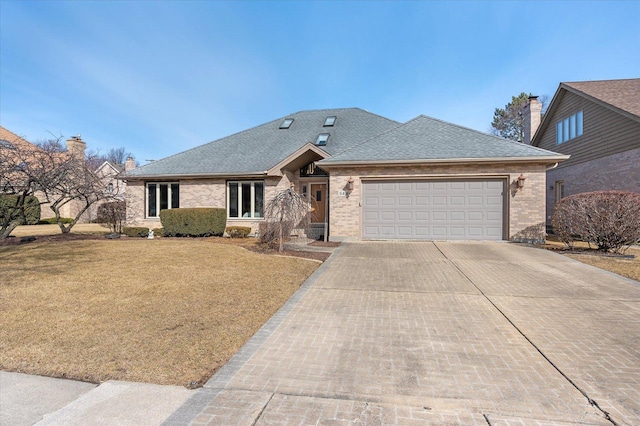 ranch-style home with a garage, concrete driveway, roof with shingles, a front lawn, and brick siding