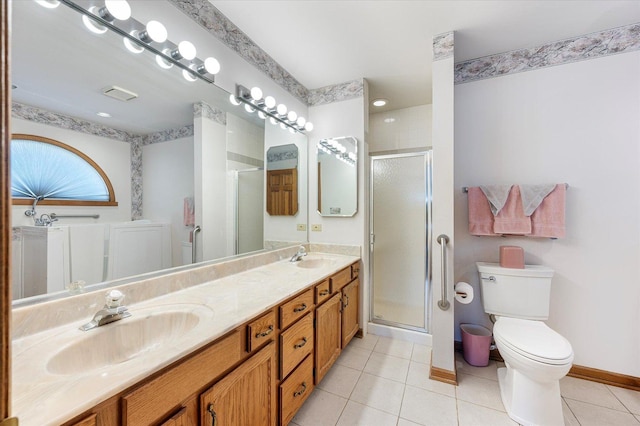 full bathroom with tile patterned flooring, a sink, a shower stall, and toilet