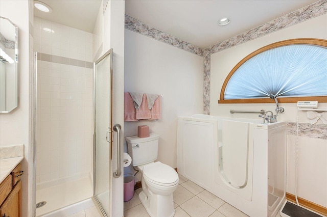 full bath with vanity, tile patterned flooring, a shower stall, and toilet