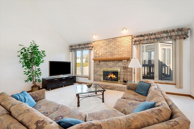 living area with lofted ceiling, a brick fireplace, carpet flooring, and baseboards