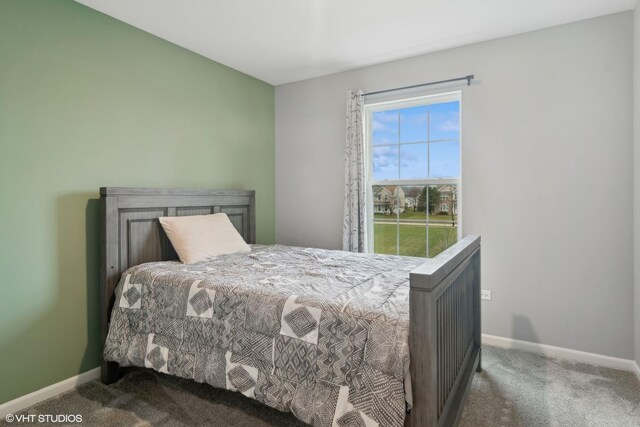 carpeted bedroom with baseboards