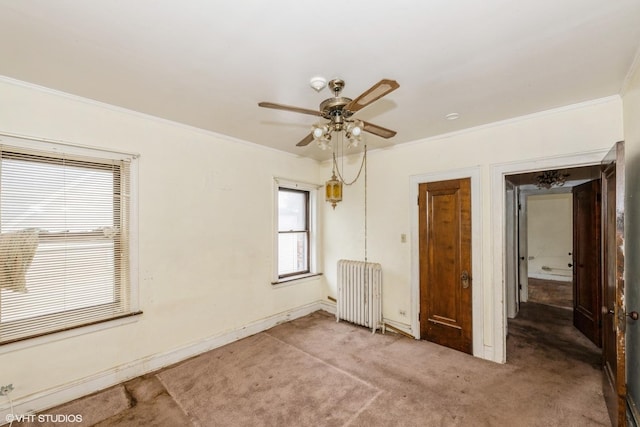 unfurnished bedroom featuring ornamental molding, radiator, light carpet, and baseboards