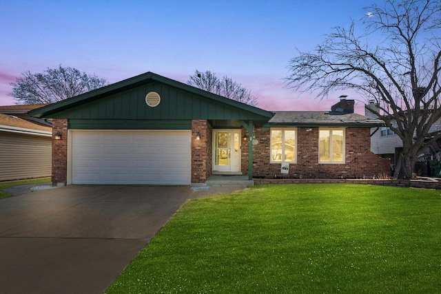 ranch-style home with a lawn, concrete driveway, a garage, brick siding, and a chimney