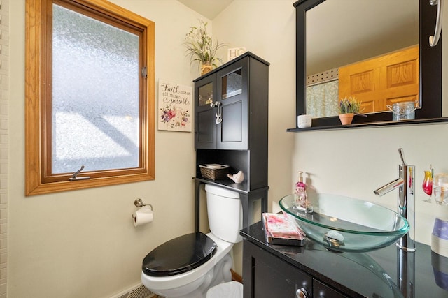 bathroom with vanity and toilet