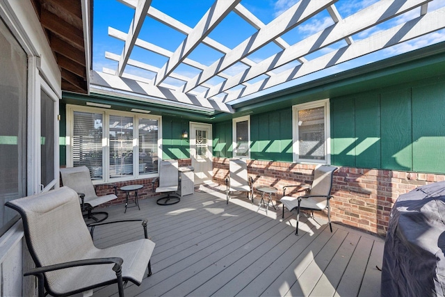 deck featuring area for grilling and a pergola