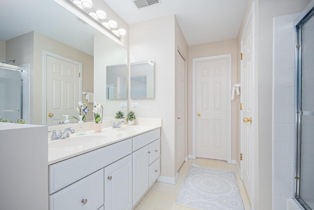 full bath featuring a closet, an enclosed shower, visible vents, and a sink