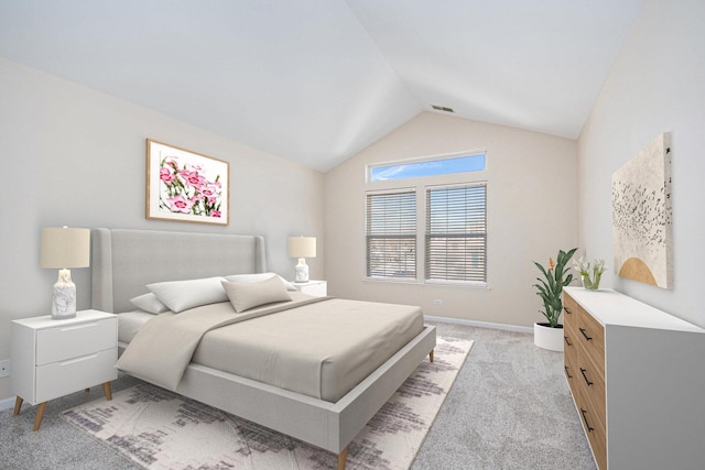 bedroom featuring baseboards, visible vents, vaulted ceiling, and light colored carpet