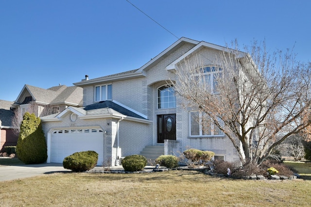 traditional-style home with a front yard, concrete driveway, and brick siding