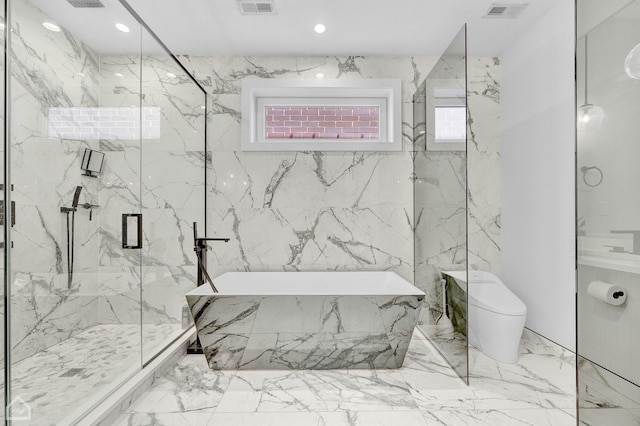 bathroom with a tub to relax in, a marble finish shower, visible vents, toilet, and stone wall