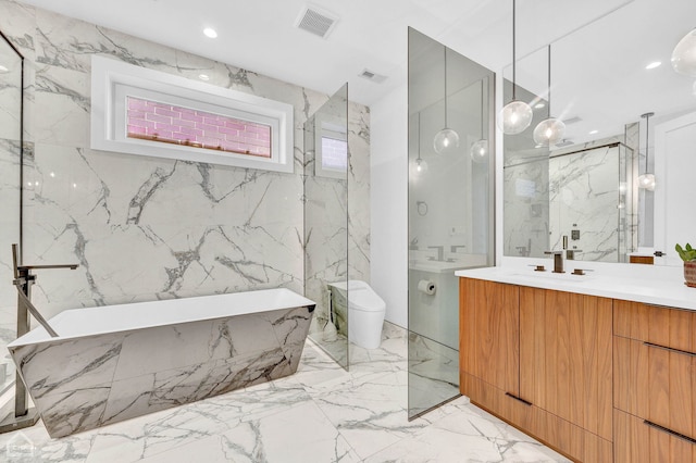 bathroom with visible vents, stone wall, vanity, and toilet